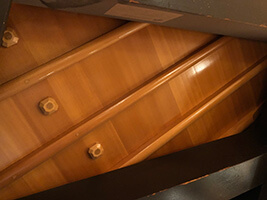 Example photo of a grand piano soundboard from underneath